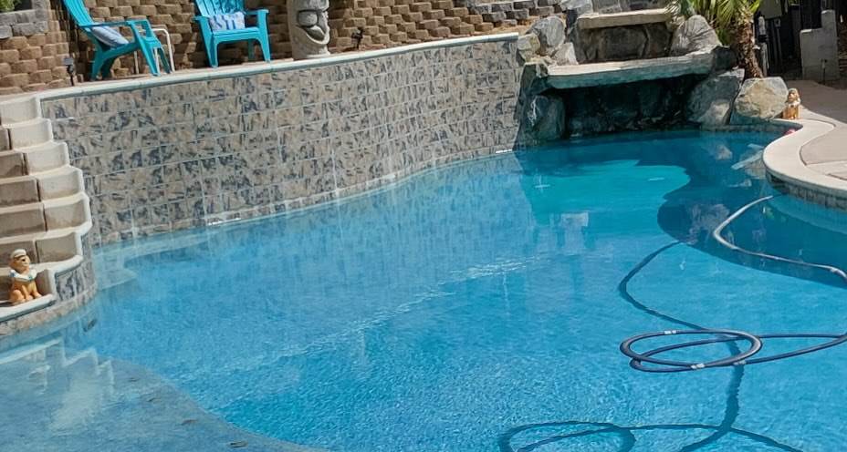 Pool tile line and clear water after cleaning